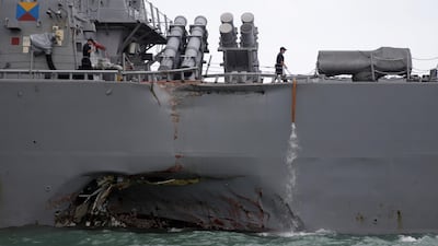 The US Navy guided-missile destroyer USS John S McCain is seen after a collision in Singapore waters. Ahmad Masood / Reuters
