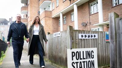 Labour leader Keir Starmer and his wife Victoria arrive at their local polling station in north London. PA