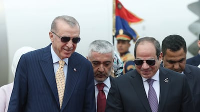 Egyptian President Abdel Fattah El Sisi, right, welcomes Turkish President Recep Tayyip Erdogan at Cairo Airport on February 14. EPA