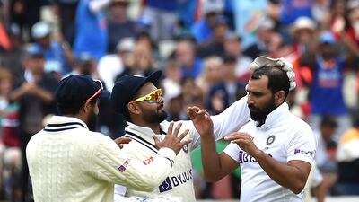 India bowler Mohammed Shami, right, celebrates with teammates after dismissing England's Jonny Bairstow. AP