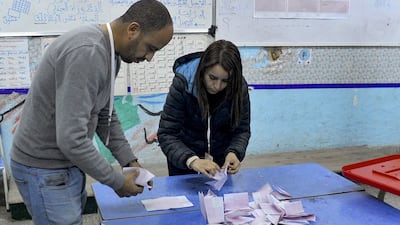 ISIE agents begin counting ballots at a polling station in Tunis during the parliamentary election. AFP