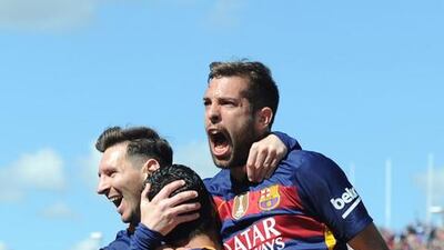 Luis Suarez of Barcelona celebrates scoring his team’s first goal with his team mates Jordi Alba and Lionel Messi during the La Liga match between Granada and Barcelona at Estadio Nuevo Los Carmenes on May 14, 2016 in Granada, Spain. (Photo by Denis Doyle/Getty Images)