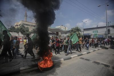 Palestinians attend the funeral of Mohammed Jamal Abu Halima, 22, who was shot dead by Israeli military during a protest along the border of the Gaza Strip. EPA/HAITHAM IMAD