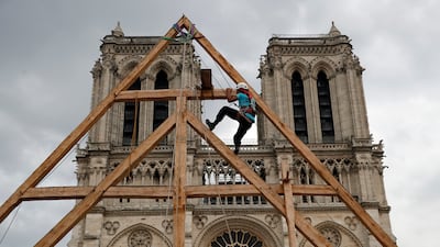 Charles, one of the carpenters restoring Notre Dame Cathedral, puts his medieval building skills on show in September 2020. AP