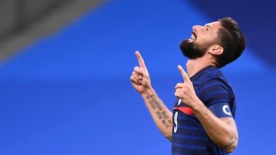 Giroud celebrates after passing Platini's total. AFP