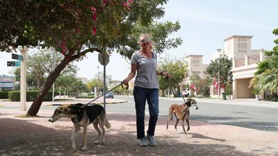 Rebecca Rees with her dogs at Jumeirah Village Triangle. She describes it as 'the perfect location', with supermarkets and shops within the community and great facilities for walking the dogs.