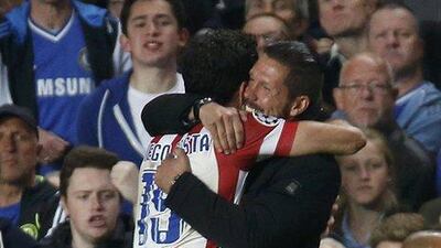 Atletico Madrid manager Diego Simeone, right, celebrates with striker Diego Costa during their Champions League victory on Wednesday night over Chelsea. Sergio Perez / Reuters / April 30, 2014