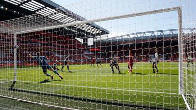 Liverpool's Mohamed Salah scores the opening goal. PA