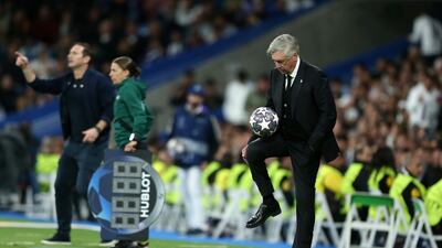 Real Madrid manager Carlo Ancelotti juggles the ball on the touchline. Getty