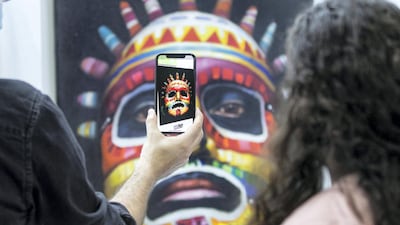 Artist Coco Valdez's paintings are best experienced through augmented reality. Leslie Pableo / The National