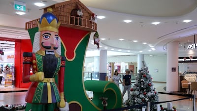 Colourful Christmas Santa boot decor at Al Wahda Mall, Abu Dhabi. Khushnum Bhandari / The National