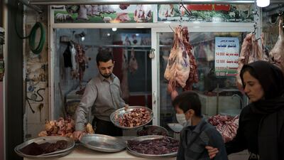 A butcher sells meat in a bazaar in central Erbil, Iraq, Sunday, Oct. 29, 2017. Erbil is demanding to retain its existing share of Iraq's national buget. (AP Photo/Felipe Dana)
