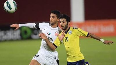 Al Dhafra's Bandar Mohammed, right, gave Al Ahli players plenty of trouble tonight. Ravindranath K / The National