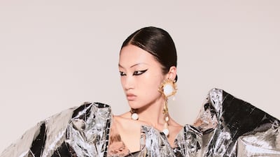 Schiaparelli showed fitted dresses topped with crumpled silver