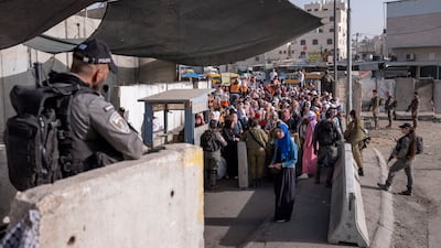 Palestinians at a checkpoint near the Israeli separation barrier, in the occupied West Bank. AP