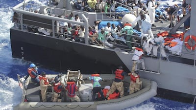 African men found floating on a raft are transferred from the the USS San Antonio to a Maltese offshore patrol vessel in the Mediterranean Sea on October 17. Reuters via US Navy