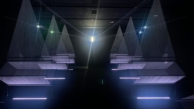 Saudi artist Muhannad Shono's Letter in Light, Lines We Write (2023) takes viewers on a spiritual journey with a stunning thread, steel and light projection installation. Hareth Al Bustani / The National