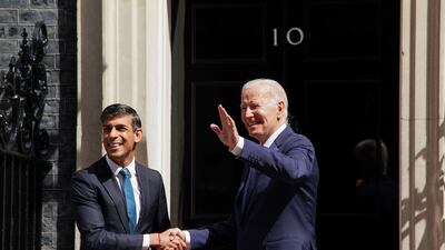 US President Joe Biden greets British Prime Minister Rishi Sunak at 10 Downing Street in London. Reuters