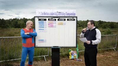 The leaderboard is updated with the latest times as entrants take part in the Irish Bog Snorkelling championship on Sunday. Charles McQuillan / Getty Images