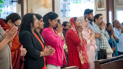 Worshippers gather for Easter Sunday Mass at St Michael’s Catholic Church in Sharjah. Despite regional tension, the service proceeded as scheduled, drawing members of the local Christian community together for the annual religious observance. Ahmed Ramzan / The National