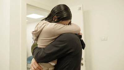 Released Israeli hostage Daniella Gilboa, 20, embraces a loved one on Saturday. Reuters