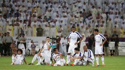 Al Ain players wait nervously before the start of the penalty shoot-out against Al Jazira in the Super Cup at Al Wasl stadium. Mike Young / The National