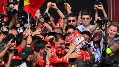 Ferrari driver Charles Leclerc celebrates with his pit crew after winning the British Grand Prix. AFP