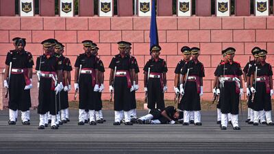 An Indian army cadet collapses during a passing out parade at Officers Training Academy in Chennai. EPA