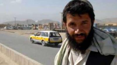 A Pashtun man waits for a taxi to take him along the dangerous Highway 1 in Afghanistan, where the Taliban has set up checkpoints.