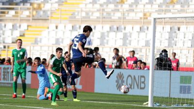 Yuya Osako scores the second of his two goals for Japan.