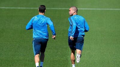 Cristiano Ronaldo of Real Madrid (L) and Pepe of Real Madrid warm up during a training session ahead of the Uefa Champions League semi-final second leg between Real Madrid and Manchester City at Valdebebas training ground on May 3, 2016 in Madrid, Spain. (Photo by Gonzalo Arroyo Moreno/Getty Images)