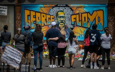 People visit a memorial to George Floyd in Minneapolis, Minnesota. AP