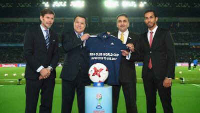 Fifa officials Zvonimir Boban, deputy secretary-general of football, Colin Smith, competitions and events chief, and Kohzo Tashima, president of the Japan Football Association, present a jersey to Aref Al Awani, general secretary of Abu Dhabi Sports Council, and UAE Football Association secretary general Mohammed Al Dhaheri. Courtesy Abu Dhabi Sports Council