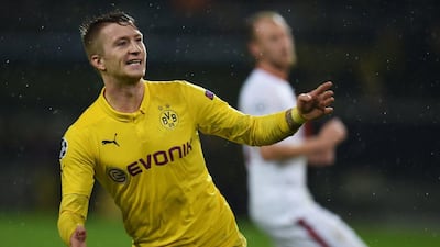 Borussia Dortmund's Marco Reus celebrates scoring in his side's Champions League win over Galatasaray on Tuesday in Dortmund. Patrik Stollarz / AFP / November 4, 2014