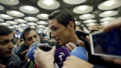 Fernando Torres answers questions upon his arrival in Madrid on Tuesday to join Atletico Madrid. Javier Lizon / EPA