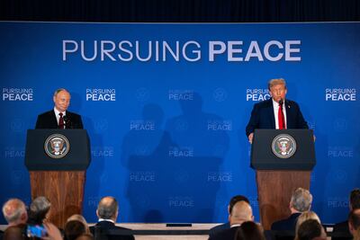 Vladimir Putin and Donald Trump field questions from the press in Anchorage, Alaska. Bloomberg