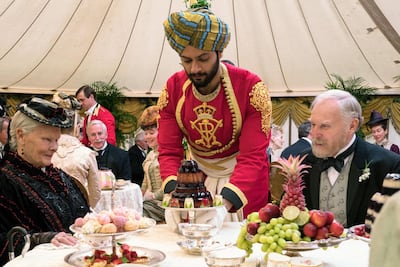 Judi Dench, from left, Ali Fazal and Tim Pigott-Smith appear in a scene from 'Victoria and Abdul'. AP