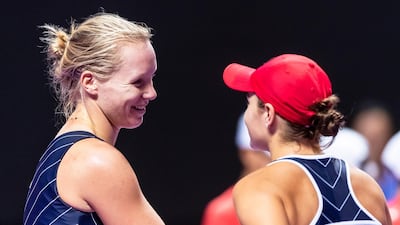 Kiki Bertens, left, is congratulated by Ashleigh Barty after winning their group stage match at the WTA Finals in Shenzhen. EPA