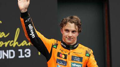 TOPSHOT - Australian driver Oscar Piastri celebrates after winning the Formula One Belgian Grand Prix at the Spa-Francorchamps circuit in Spa, on July 27, 2025. (Photo by Dimitar DILKOFF / AFP)