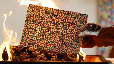 British artist Damien Hirst takes part in a burn event which is part of his latest NFT exhibition "The Currency", in London, Britain, October 11, 2022. REUTERS / Hannah McKay TPX IMAGES OF THE DAY