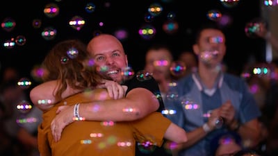 Fans embrace in London after England score against Iran. Getty Images