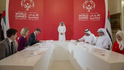 Sheikh Mohammed bin Zayed at the ceremony. With him are Dr Timothy Shriver, Chairman of the Special Olympics, third left, and Mohamed Al Junaibi, Executive Director of Protocol Agenda and Media Sections of the Crown Prince Court of Abu Dhabi, third right. Mohamed Al Hammadi / Crown Prince Court - Abu Dhabi