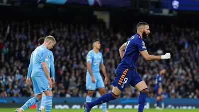 Karim Benzema runs off in celebration after scoring Real Madrid's first goal. PA