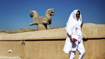 A Spanish tourist walks past an Achaemenid griffin at the ancient Persian city of Persepolis near Shiraz in southern Iran. The election of president Hassan Rouhani last year, and his decision to resume negotiations with the United States and other leading nations about Iran’s nuclear programme, has been a catalyst for Iranian tourism. Behrouz Mehri / AFP