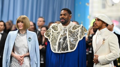 TOPSHOT - (L-R) Vogue Editor-in-Chief Anna Wintour, US actor Colman Domingo, and race car driver Lewis Hamilton arrive for the 2025 Met Gala at the Metropolitan Museum of Art on May 5, 2025, in New York. The Gala raises money for the Metropolitan Museum of Art's Costume Institute. The 2025 Met Gala is themed "Tailored for You," aligning with the Costume Institute’s exhibition, "Superfine: Tailoring Black Style," set to open to the public on May 10. (Photo by Angela WEISS / AFP)