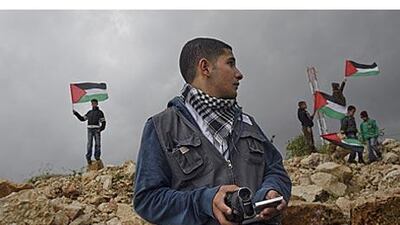 Arafat Kanaan, 17, founder of Ni'lin Media Group, says his camera is like a weapon.