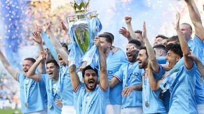 Ilkay Guendogan lifts the Premier League trophy. Getty