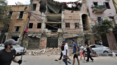Volunteers help in removing rubble at the damaged Gemayzeh area in Beirut that was damaged in the August 4 port explosion. Both the IMF and World Bank pledged to help the country. EPA