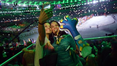 Spectators take a “selfie” at the Closing Ceremony of the Rio 2016 Olympic Games, at the Maracana Stadium on August 21. Ed Jones / AFP.
