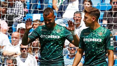 Real Betis' Jese Rodriguez celebrates scoring their second goal with Loren Moron. Reuters